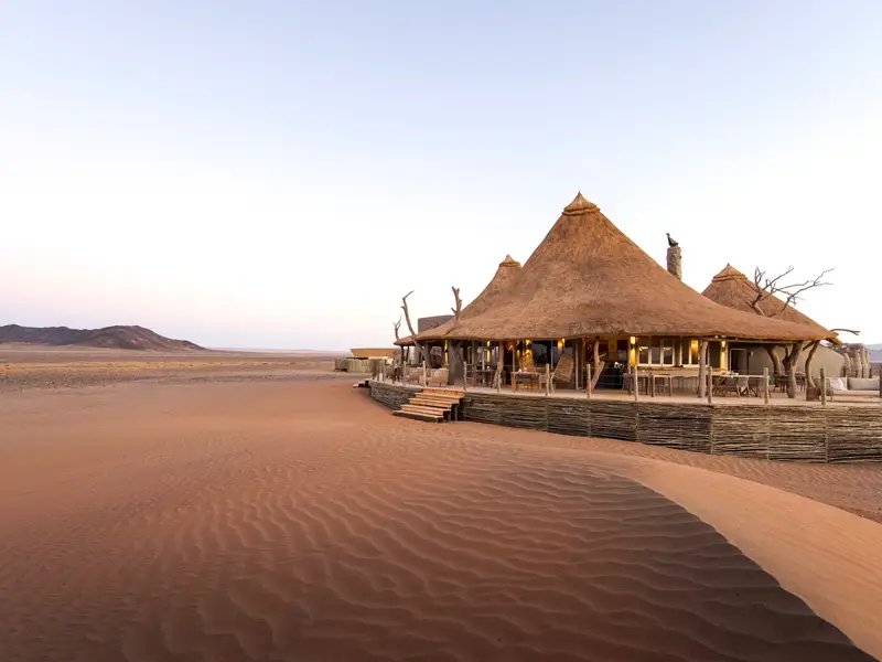 Exterior of Little Kulala Lodge with sand dunes